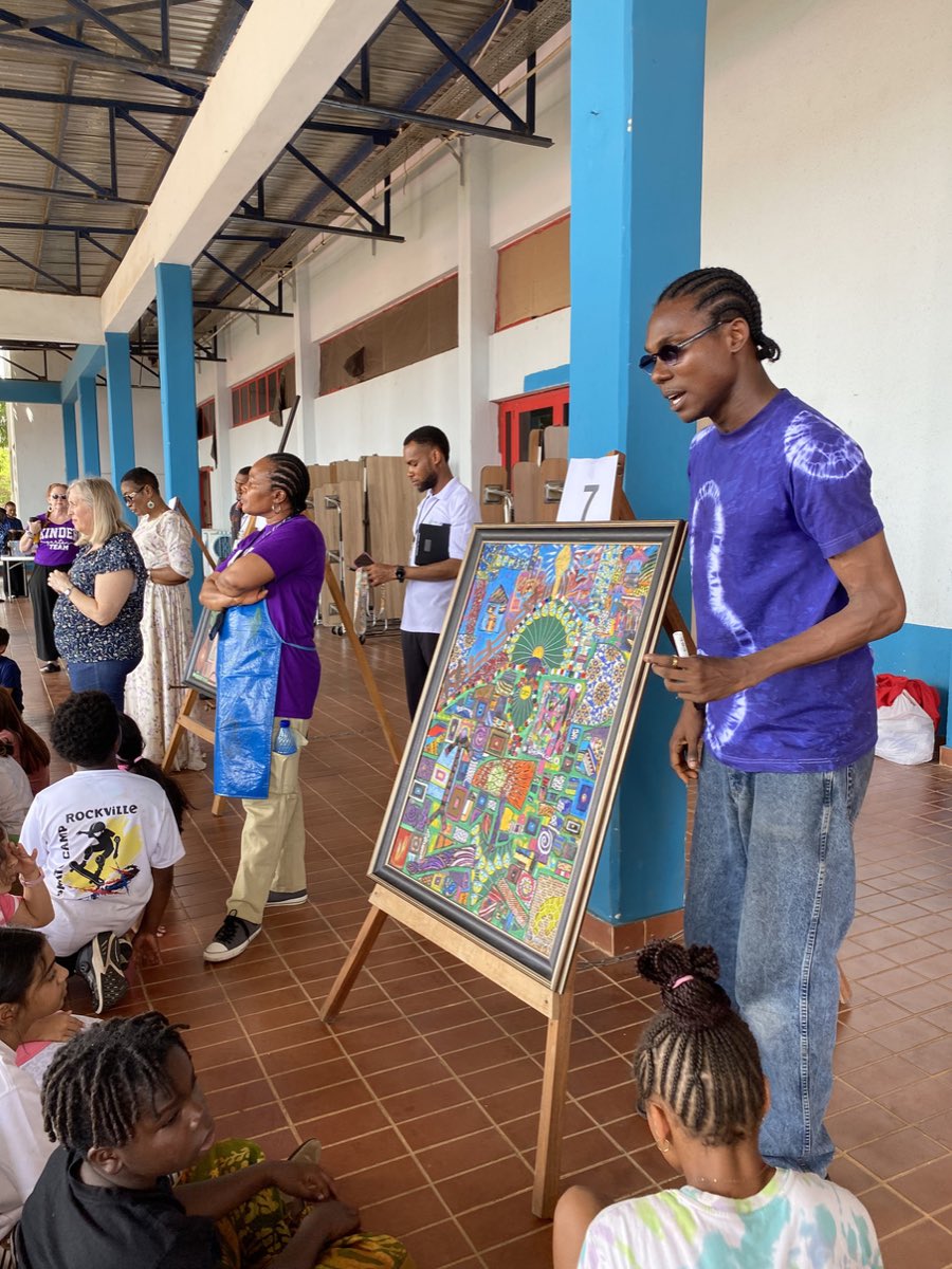 The artist with works from the exhibition