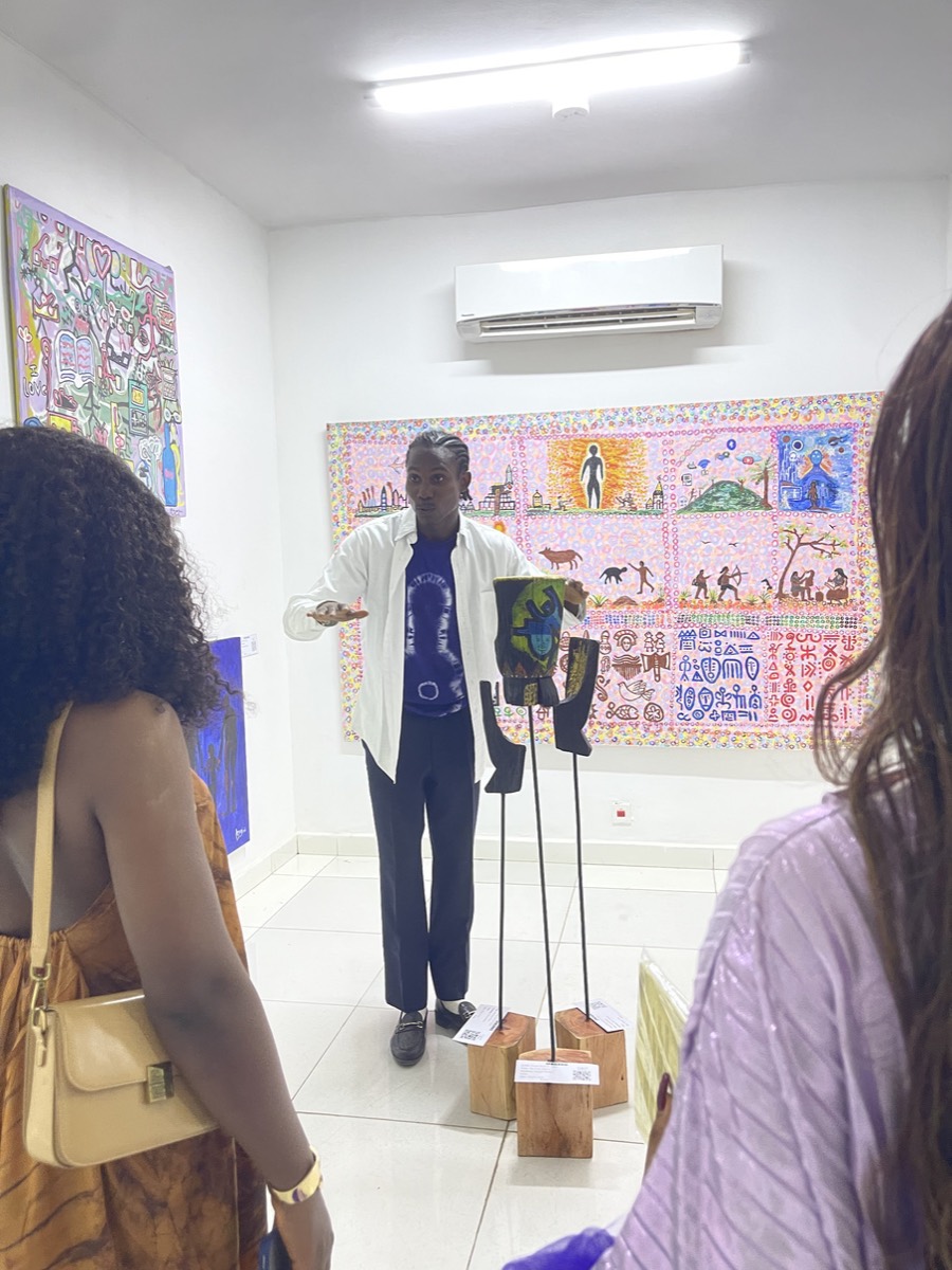 The three standing works in the room, with visitors